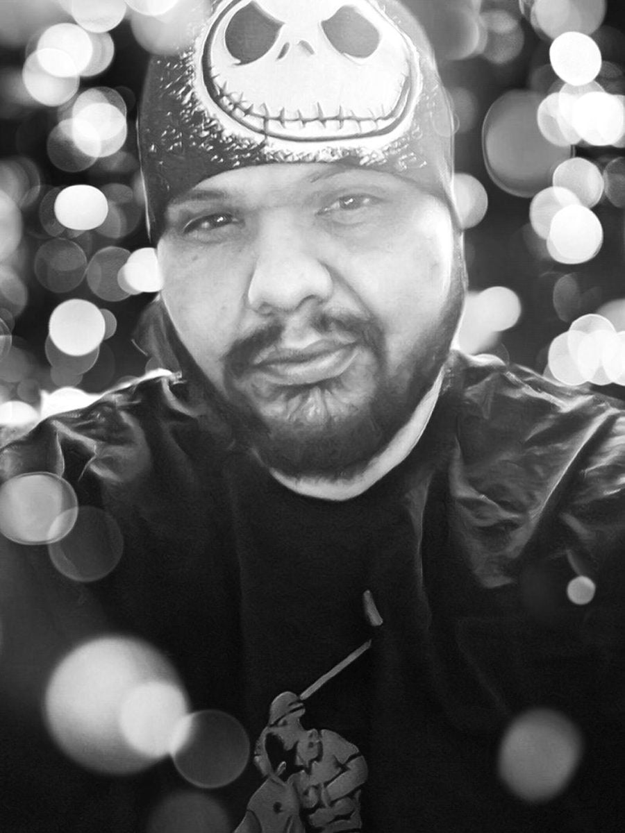 Heavily stylized black and white photo of Jose Rios with blurry bokeh effect